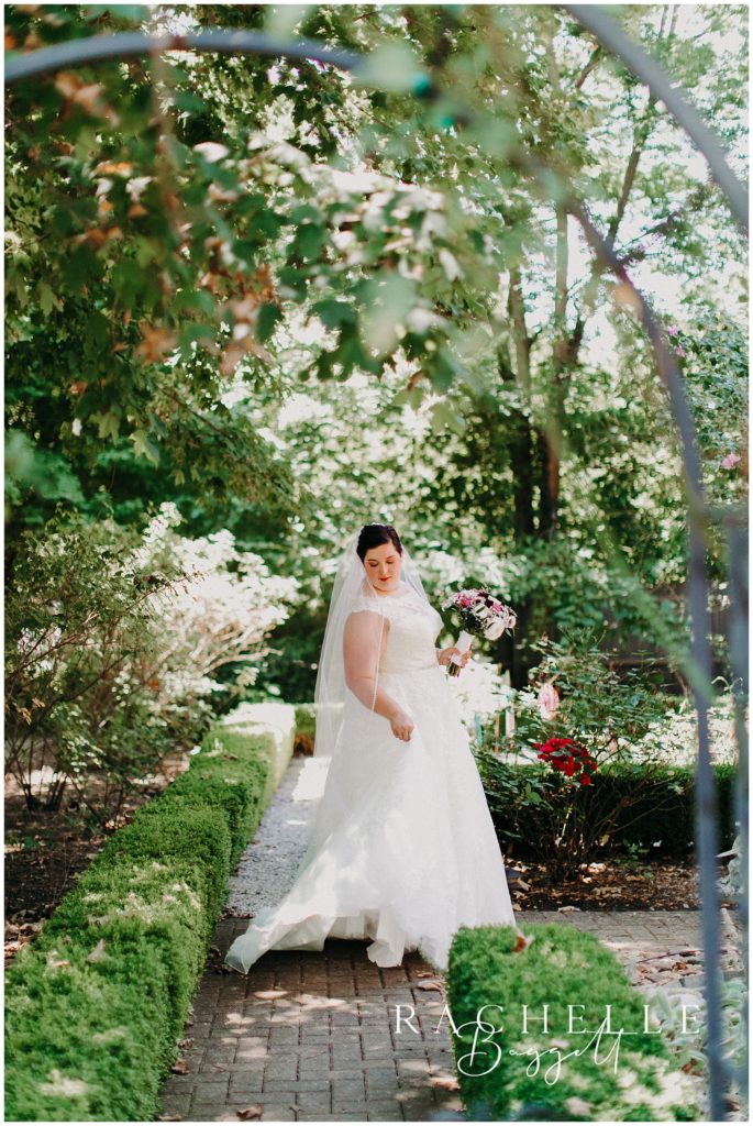 woman wearing a wedding dress in a garden