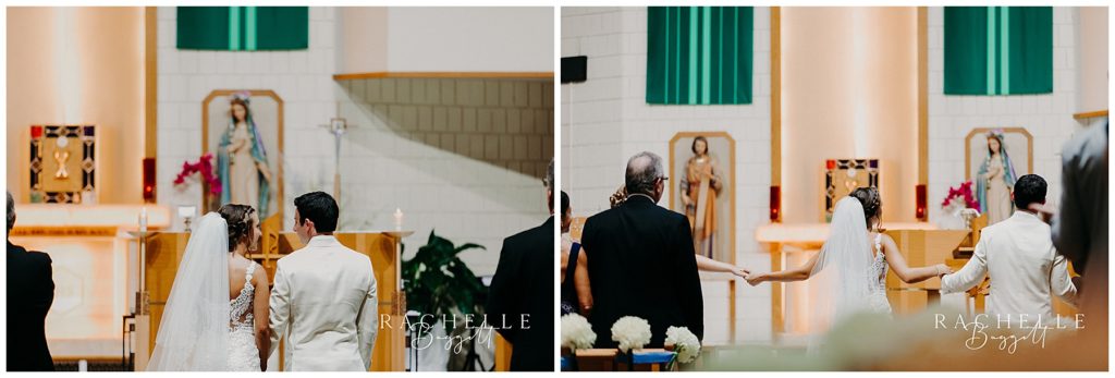 a bride and groom stand in front of an altar at St. Joseph Catholic Church