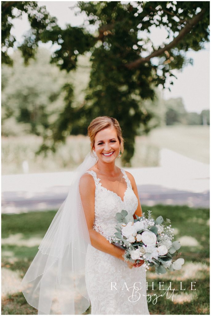 bride smiles at the camera. Evansville Wedding Photographer.