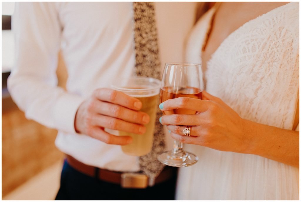 The new bride and groom share a toast together | wedding photography