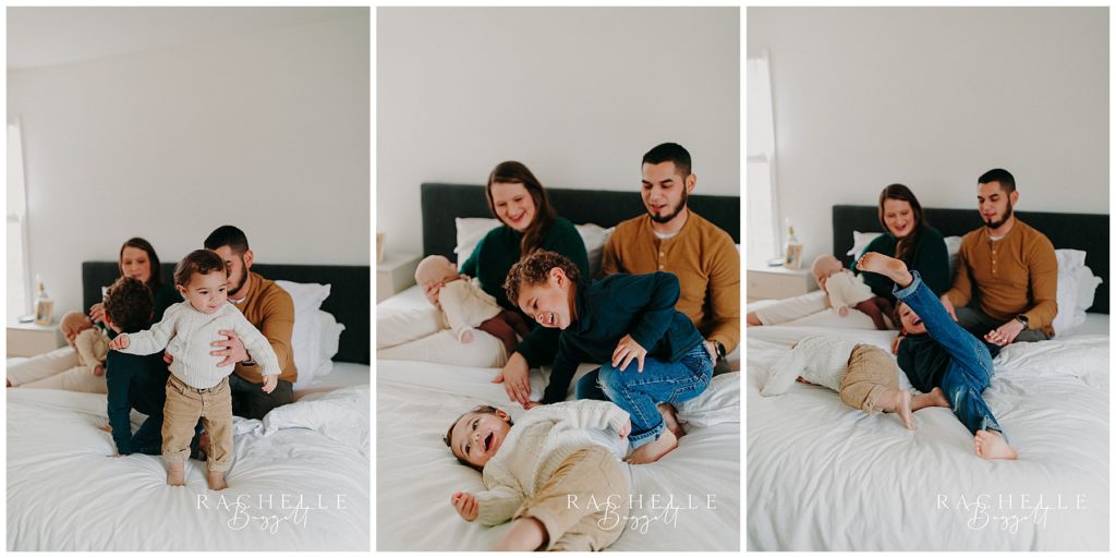 Family of five jumps on the bed playfully