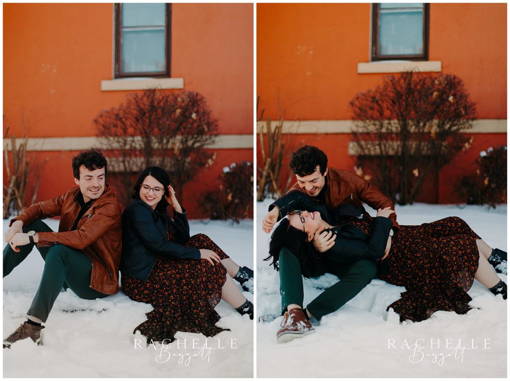 husband and wife lounging in the snow during dreamy anniversary session