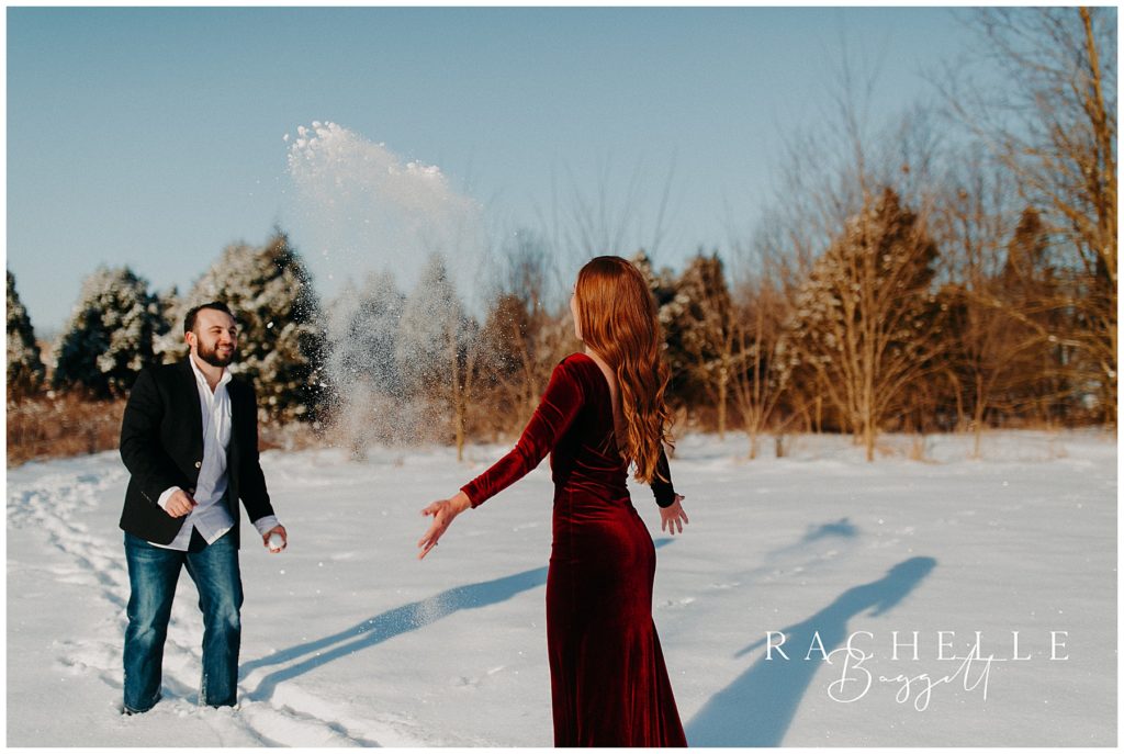 woman throws snow at her future husband