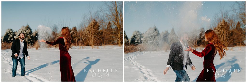man and woman throw snow up in the air together during their snowy sunrise engagement session