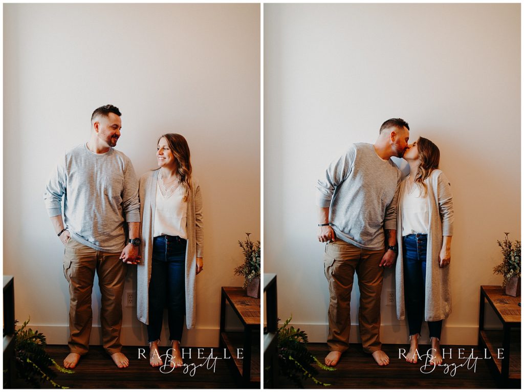 husband and wife share a kiss during Downtown Loft Couples Session