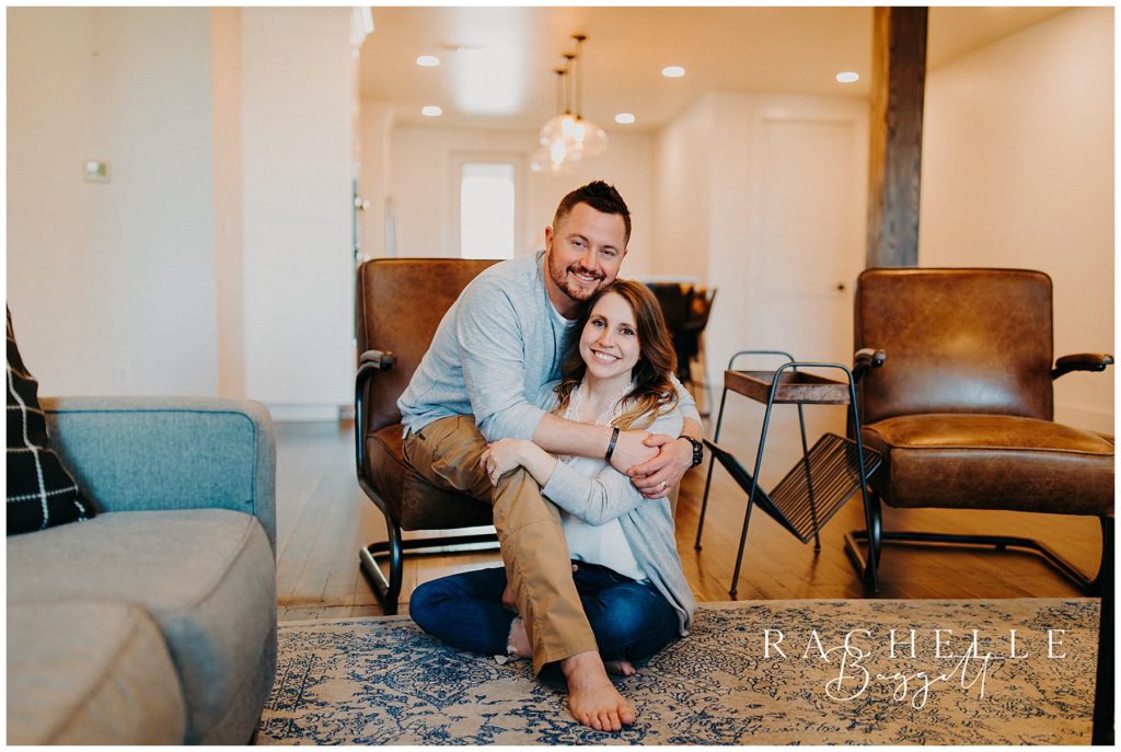 husband and wife smile at the loft on sixth street for their Downtown Loft Couples Session