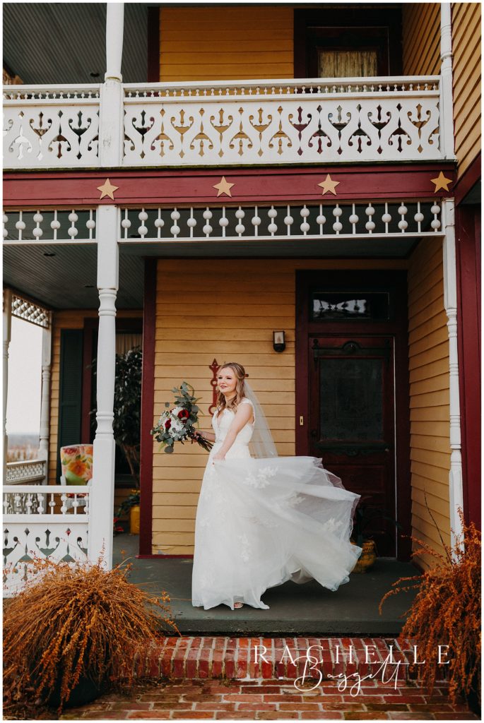 bride posing outside venue before intimate wedding ceremony