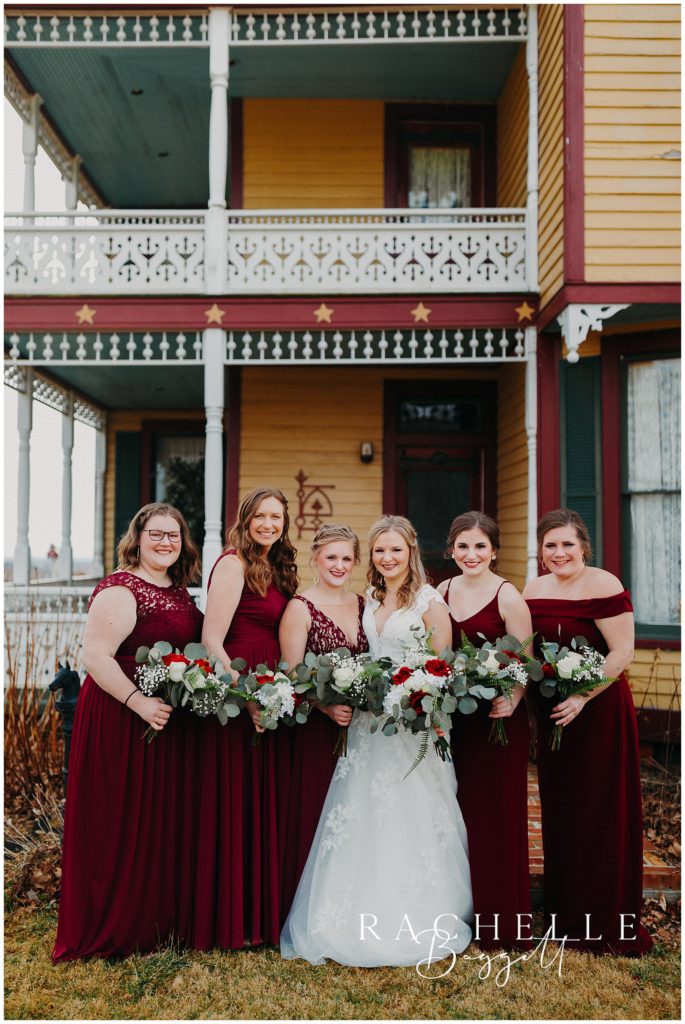 bridesmaid photos outside yellow barn