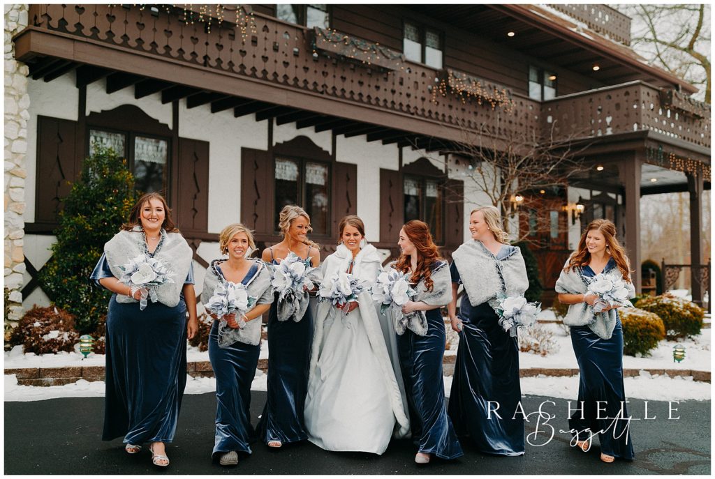 bridal party walking outdoors in snow