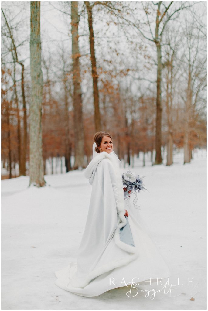 bride outdoors in her winter cape