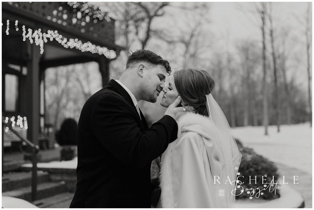 elpers snowy wedding, bride and groom lean in for kiss