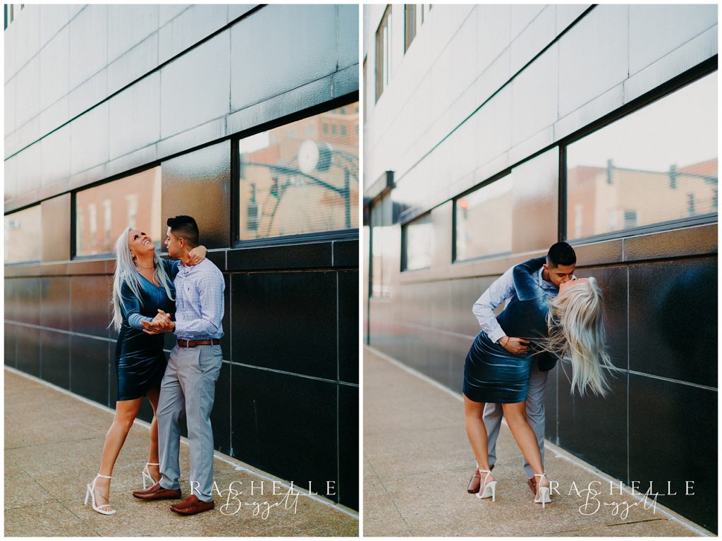 man and woman kiss downtown during engagement session
