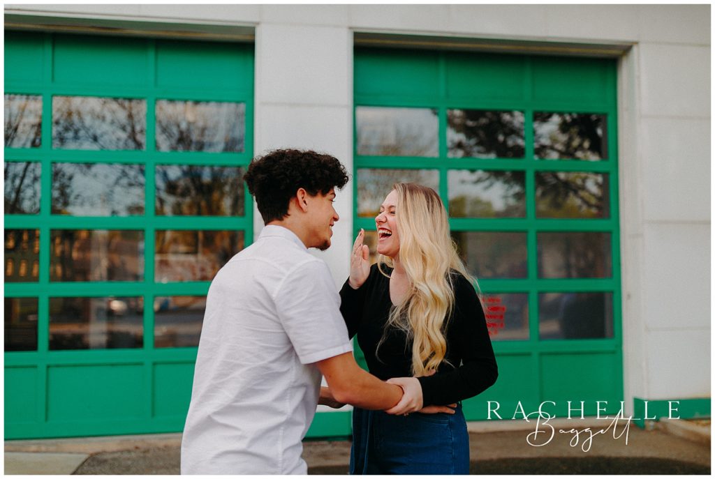 couple laughing during Engagement in Historic Downtown