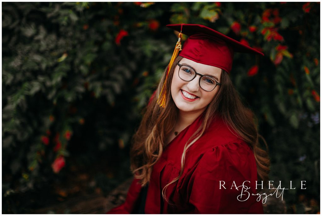 senior girl smiling with glasses