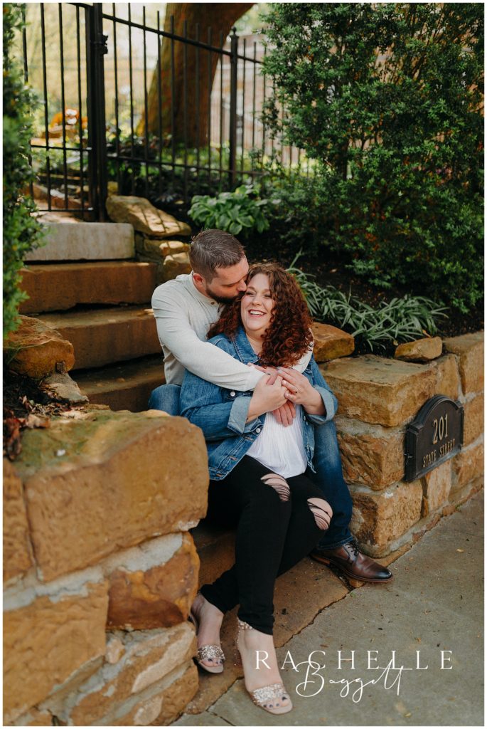 man kissing woman's temple during small town mini session