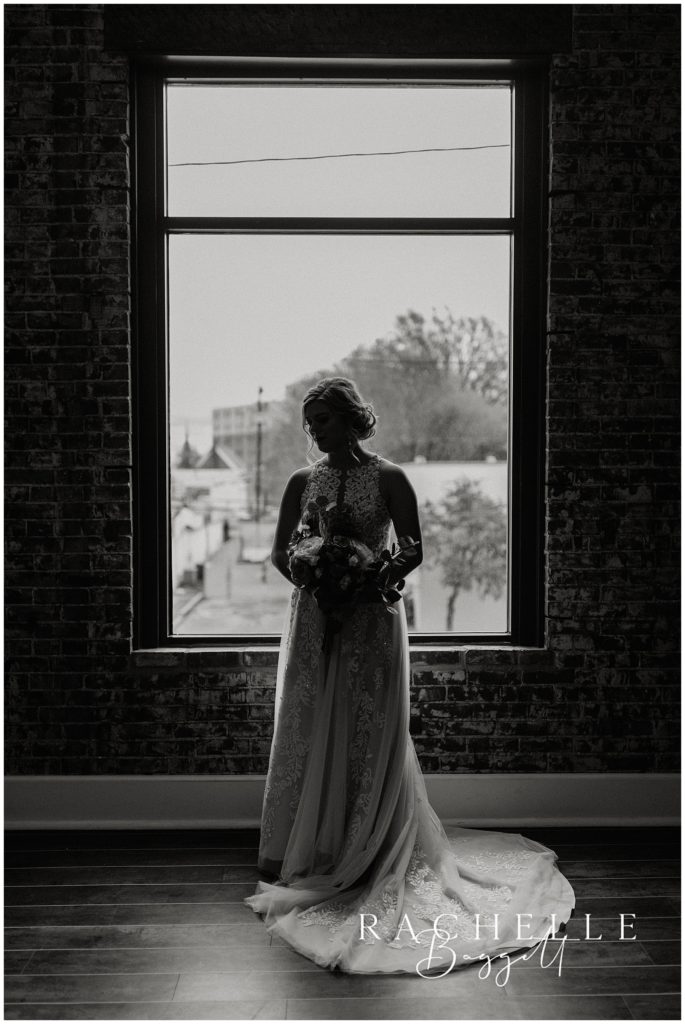 bridal portrait by window during Spring Wedding at City View