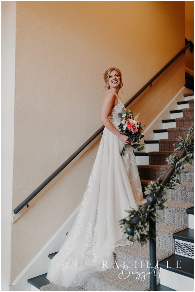 bride posing on staircase during Spring Wedding at City View